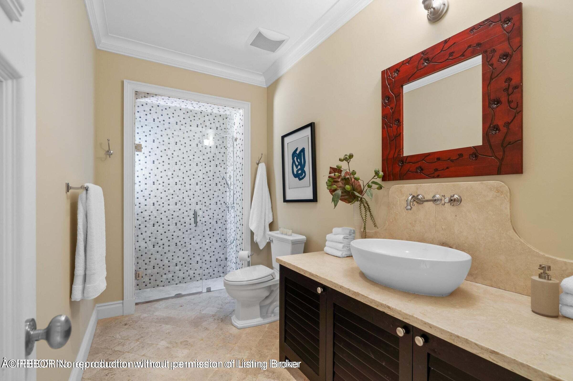 265 List Road Palm Beach, FL 33480 - Photo 17 of 21 a bathroom with a sink a toilet and shower