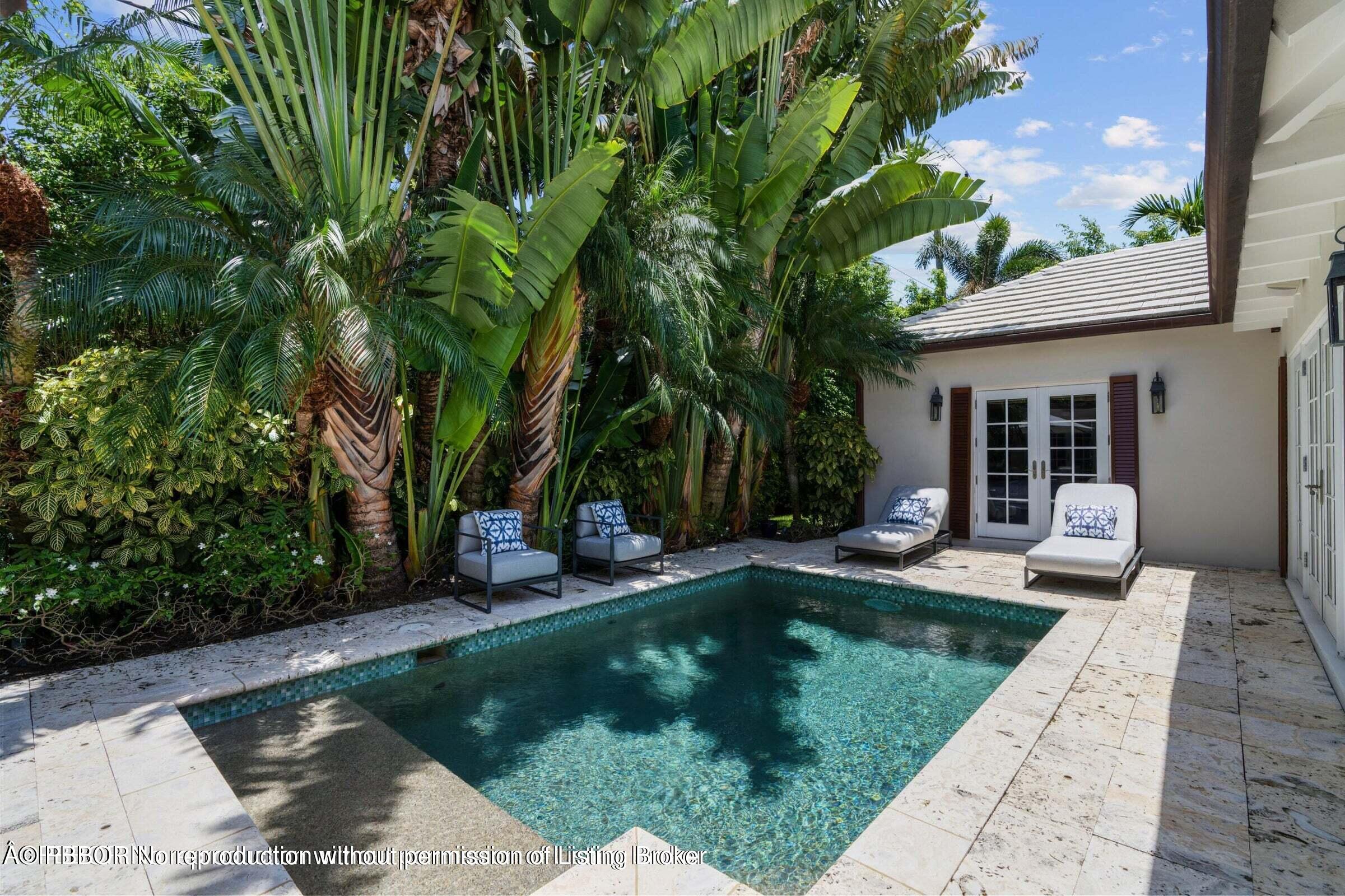 265 List Road Palm Beach, FL 33480 - Photo 18 of 21 a view of a house with backyard sitting area and swimming pool