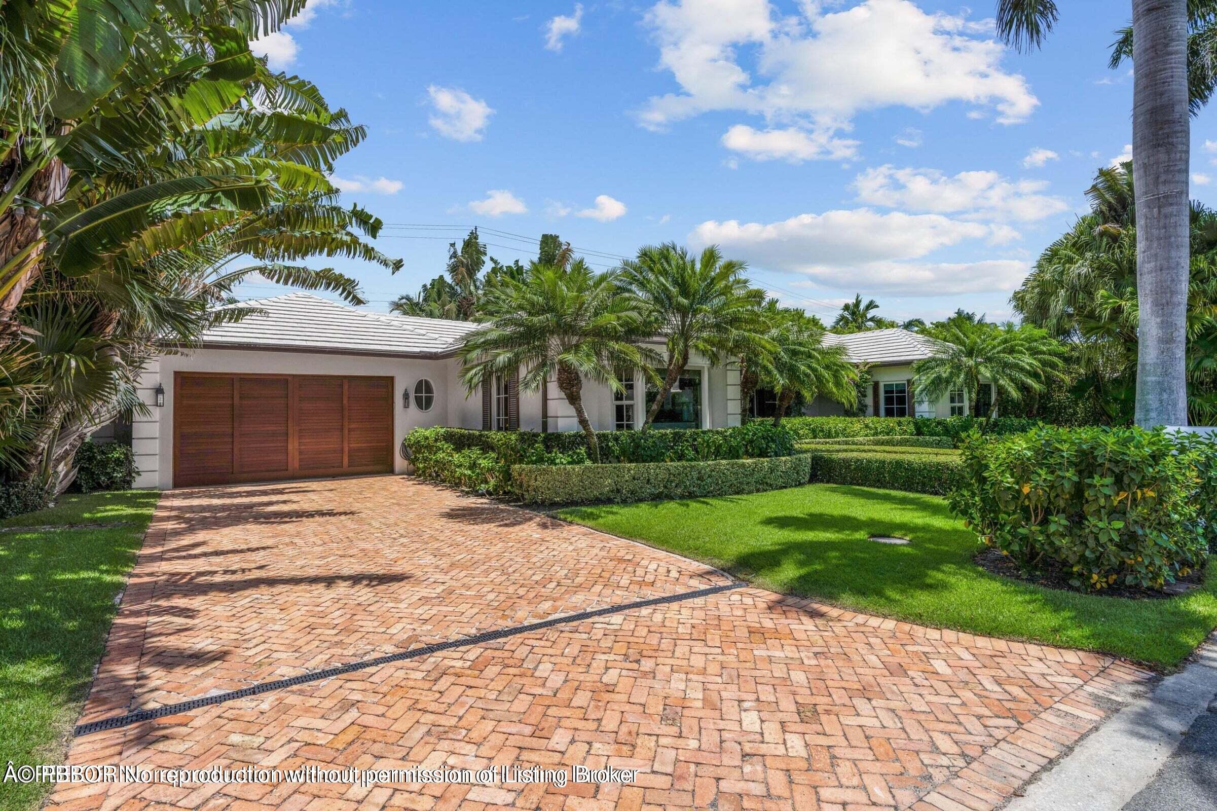 265 List Road Palm Beach, FL 33480 - Photo 21 of 21 a front view of a house with garden
