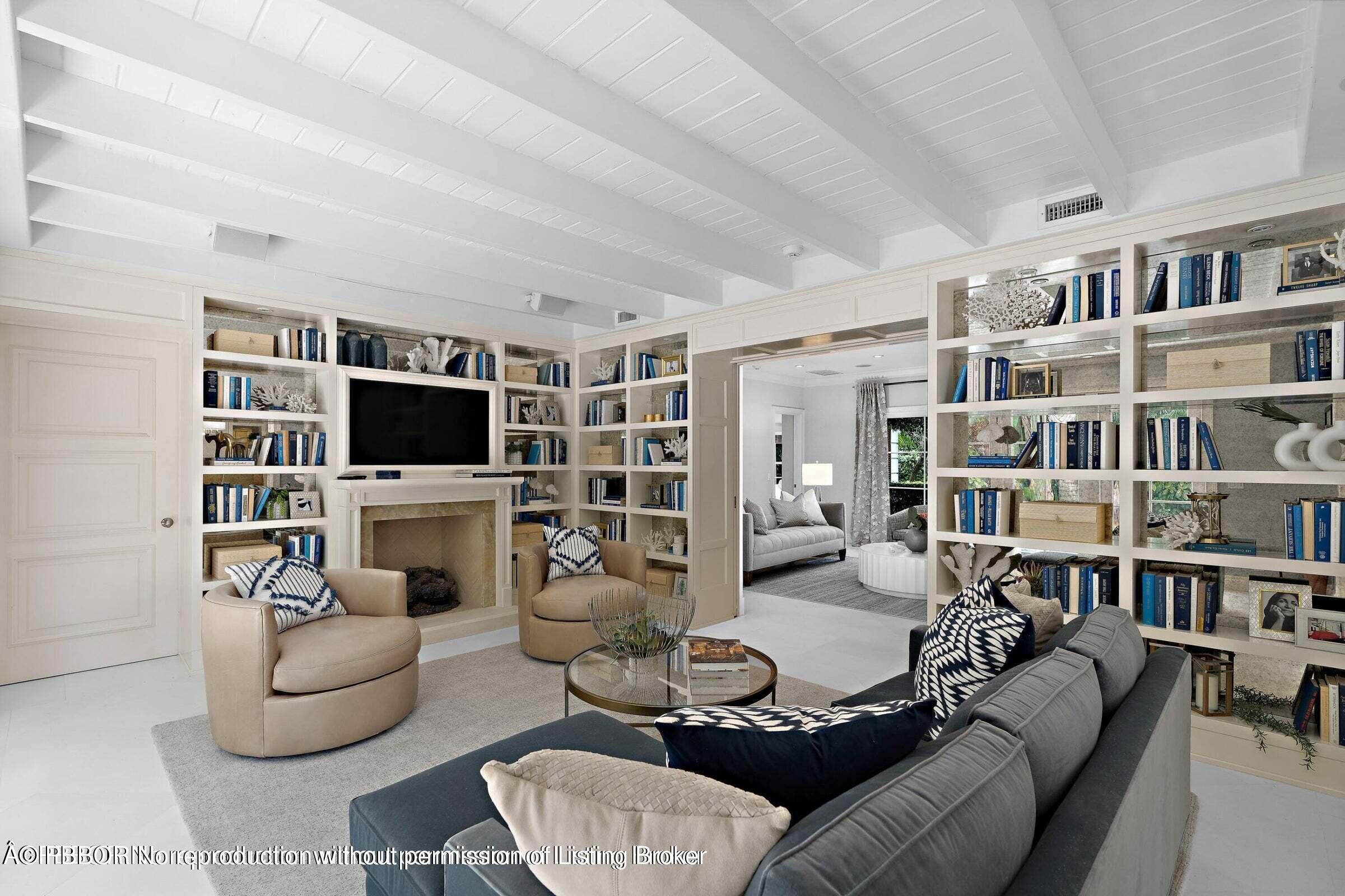 265 List Road Palm Beach, FL 33480 - Photo 7 of 21 a living room with furniture a flat screen tv and a fireplace