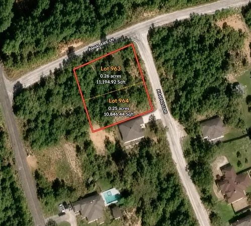 an aerial view of a residential houses with street