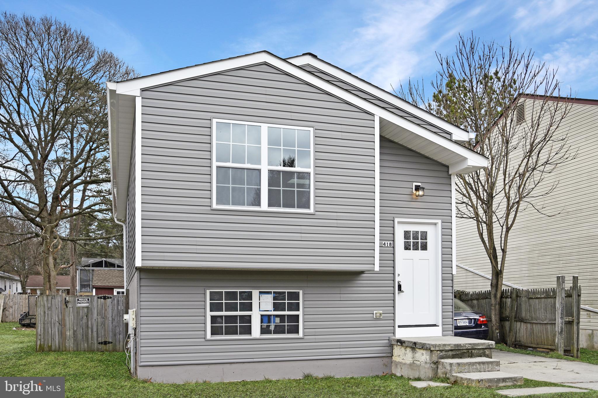 418 Rose Avenue Glen Burnie, MD 21061 - Photo 1 of 31 a front view of a house with a yard