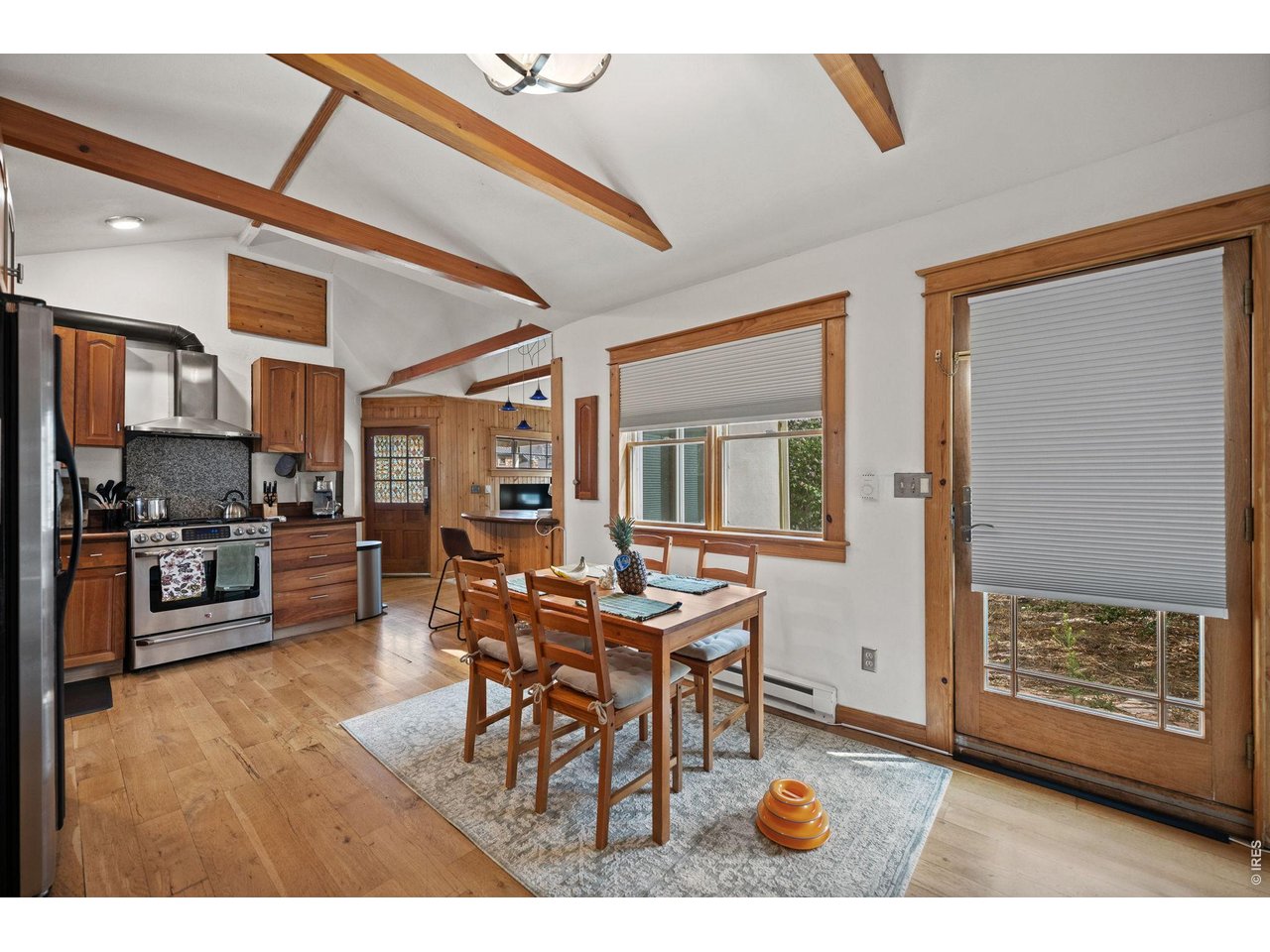 3005 6th Street Boulder, CO 80304 - Photo 21 of 41 a dining room with furniture and wooden floor