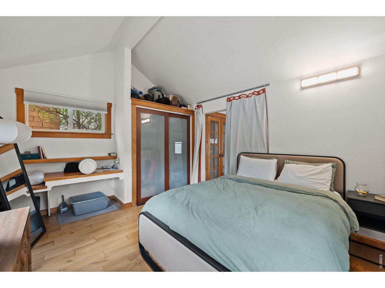 3005 6th Street Boulder, CO 80304 - Photo 25 of 41 a bedroom with a bed and a desk