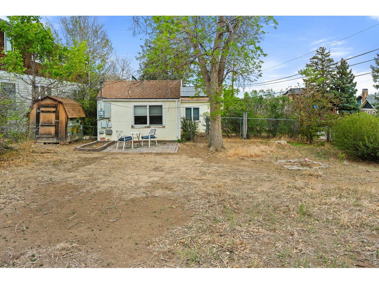 3005 6th Street Boulder, CO 80304 - Photo 28 of 41 a view of a house with a yard