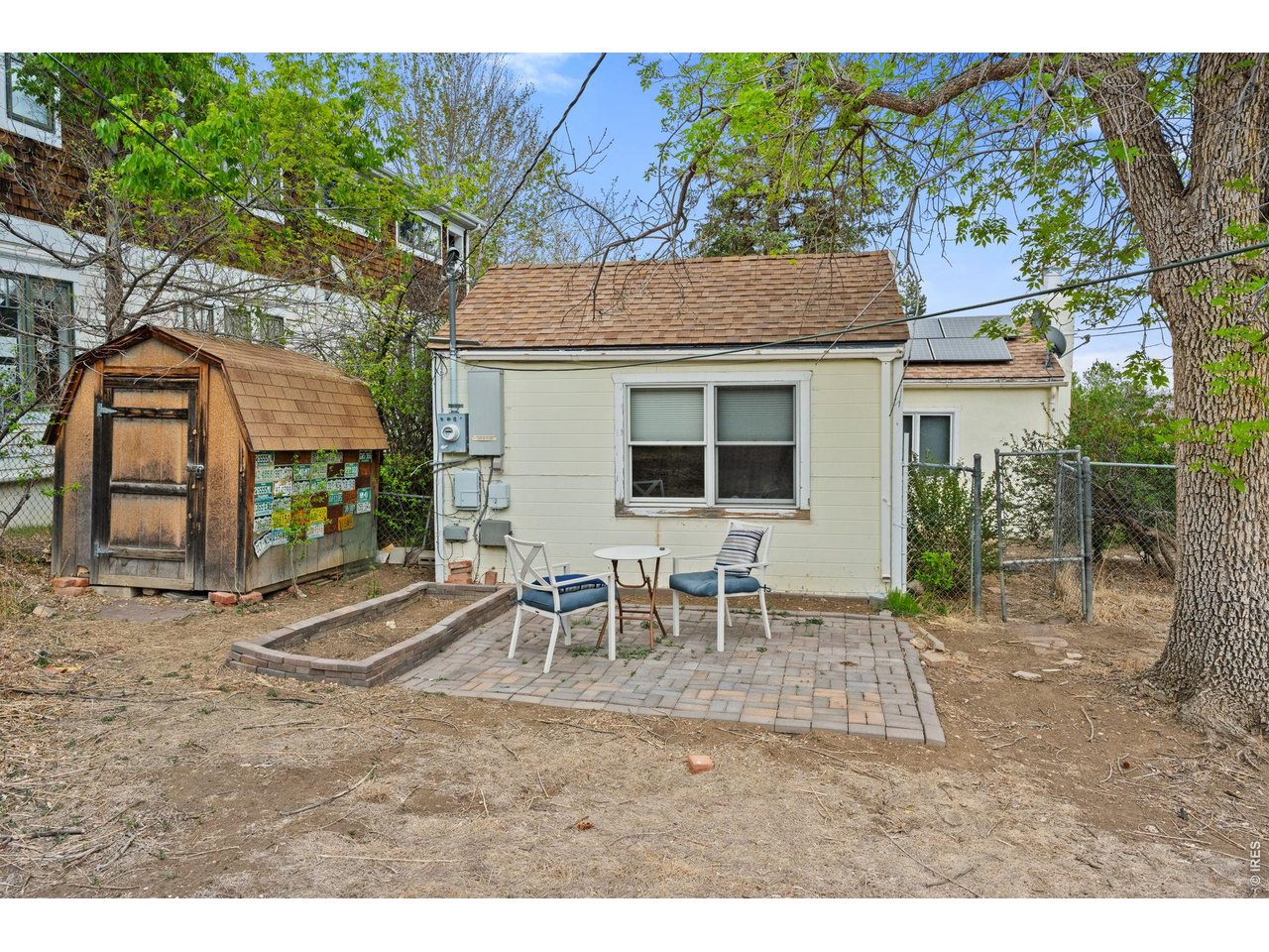 3005 6th Street Boulder, CO 80304 - Photo 29 of 41 a backyard of a house with table and chairs