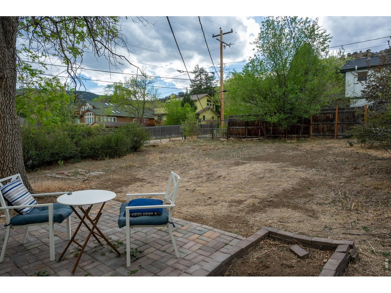 3005 6th Street Boulder, CO 80304 - Photo 31 of 41 a backyard of a house with yard and outdoor seating