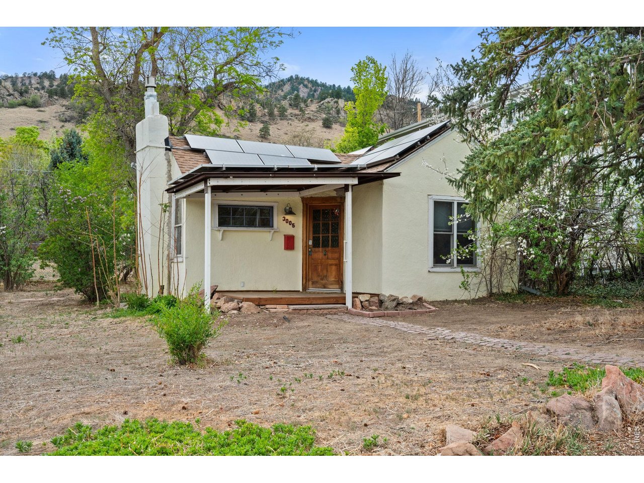 3005 6th Street Boulder, CO 80304 - Photo 7 of 41 a house with a tree in front of it