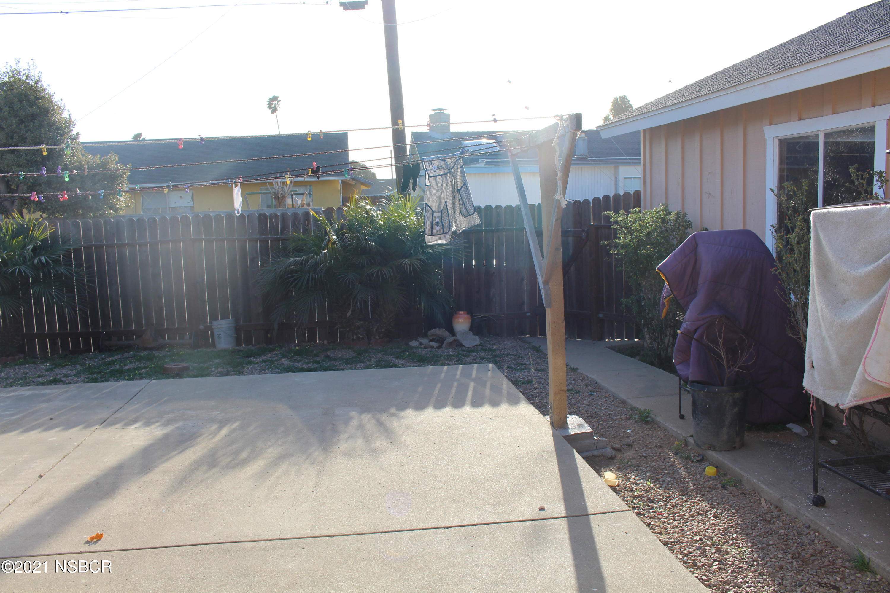 329 North X Street Lompoc, CA 93436 - Photo 2 of 6 a view of a back yard