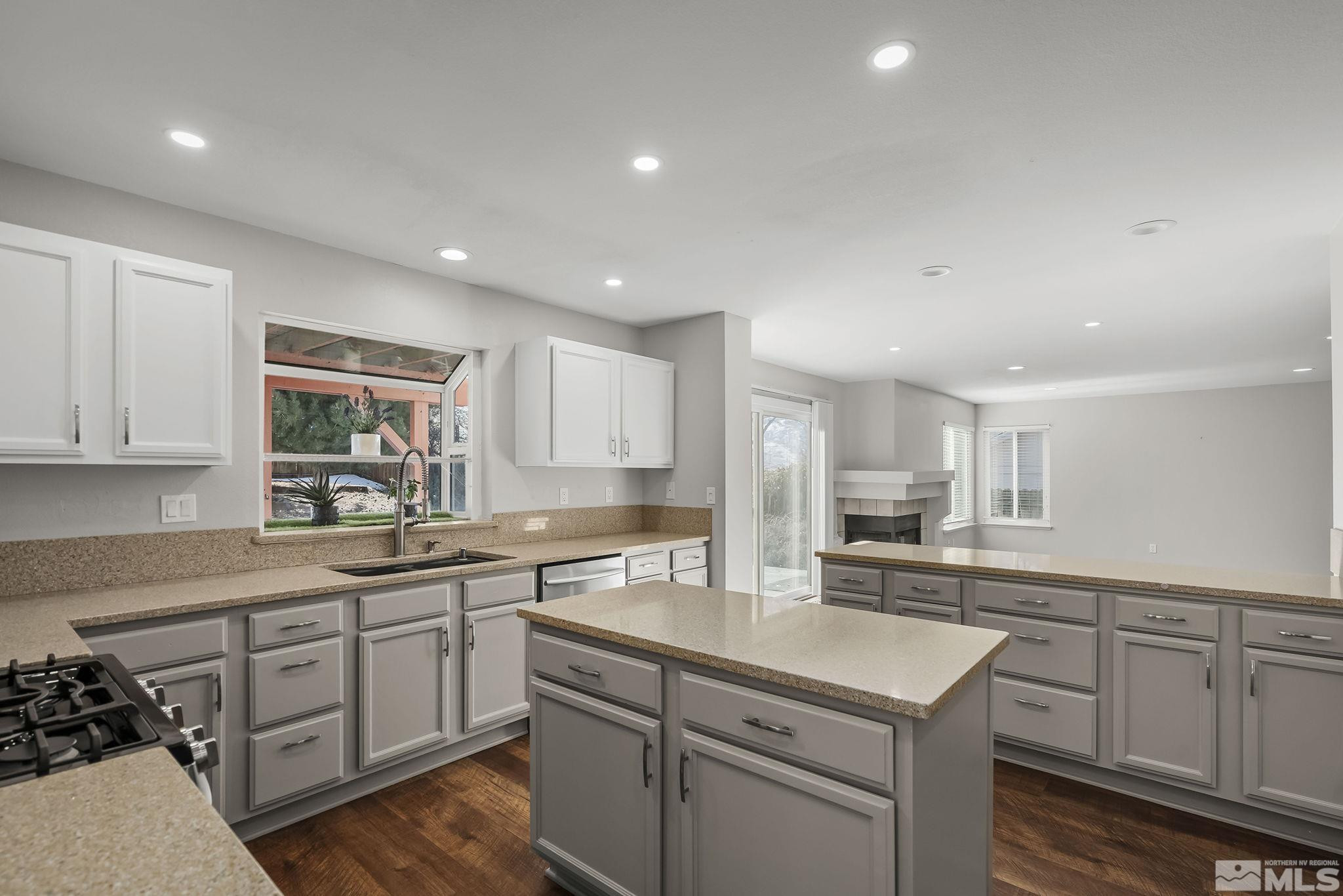5380 Simons Drive Reno, NV 89523 - Photo 11 of 39 a kitchen with a sink stove and cabinets