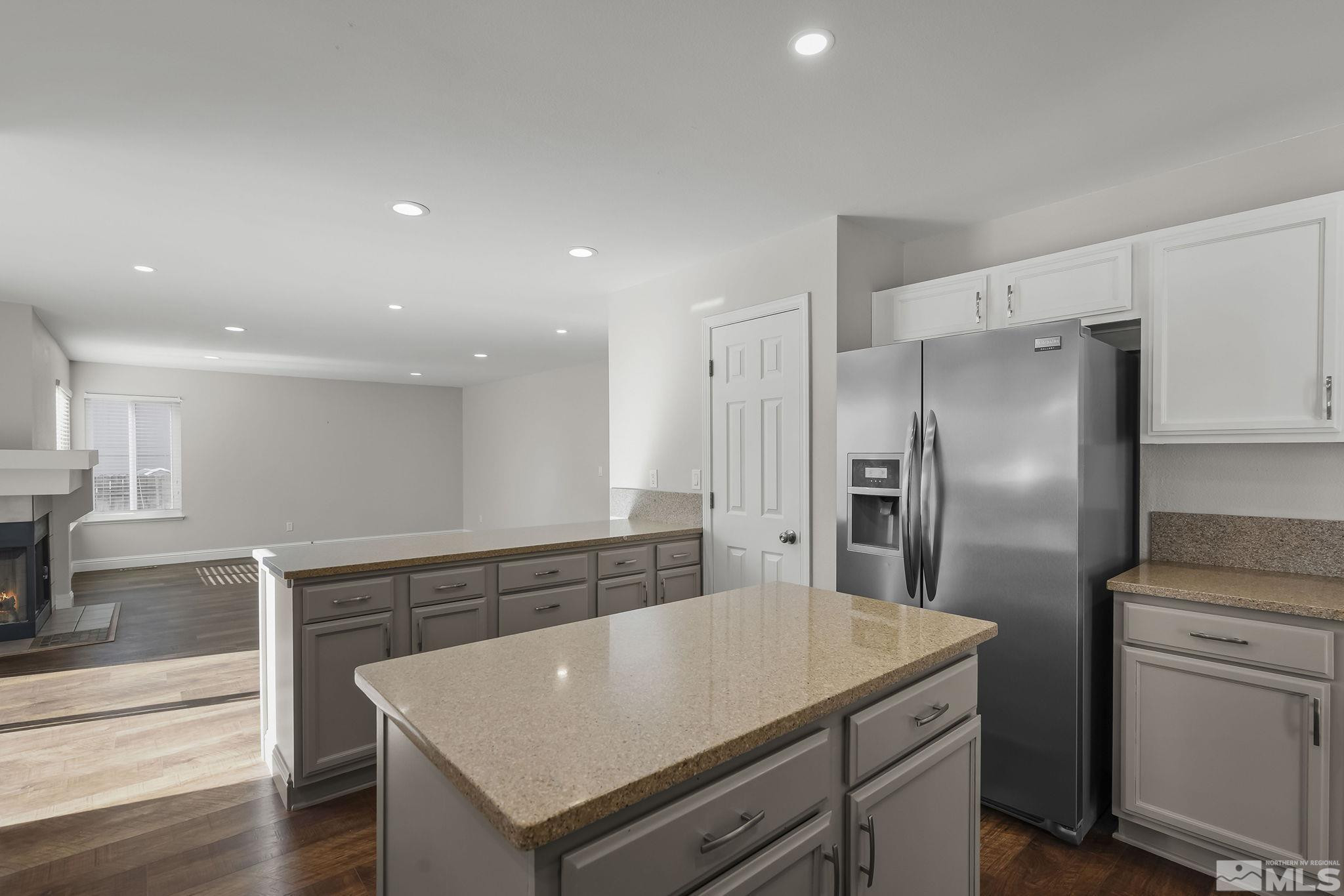 5380 Simons Drive Reno, NV 89523 - Photo 14 of 39 a view of a kitchen with a stove a refrigerator and a sink