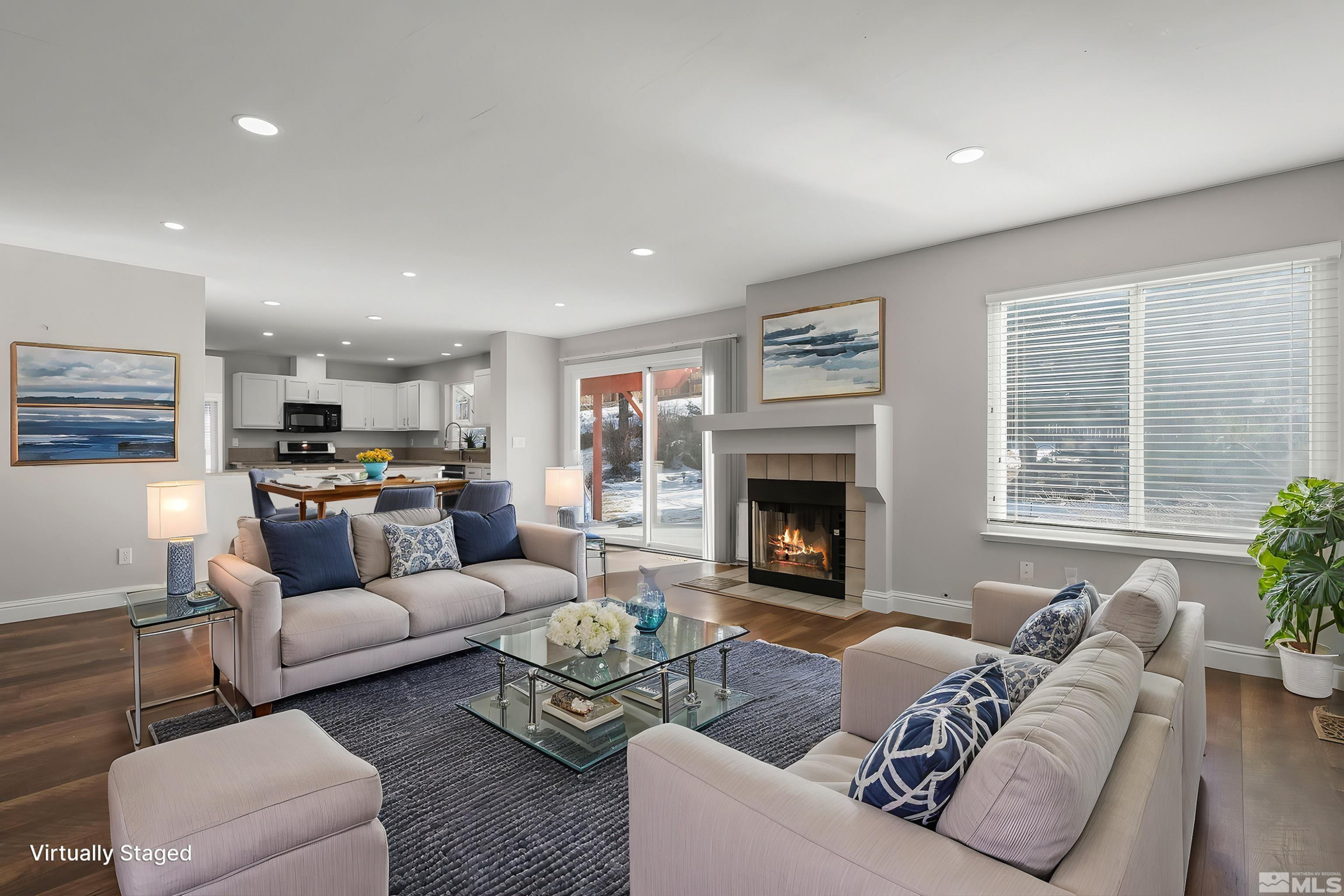 5380 Simons Drive Reno, NV 89523 - Photo 16 of 39 a living room with furniture fireplace and a large window