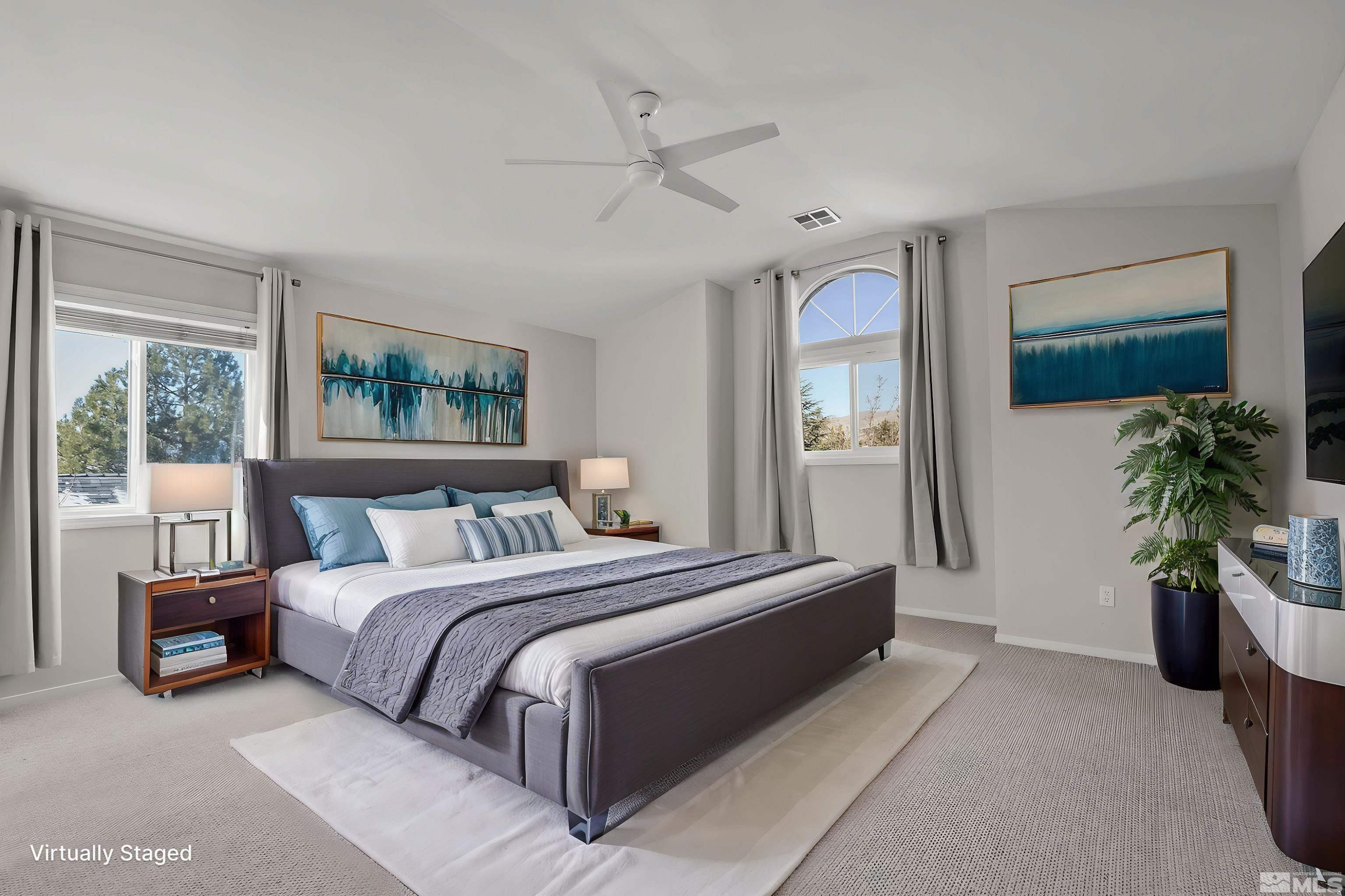 5380 Simons Drive Reno, NV 89523 - Photo 20 of 39 a bedroom with a bed lamp and a potted plant