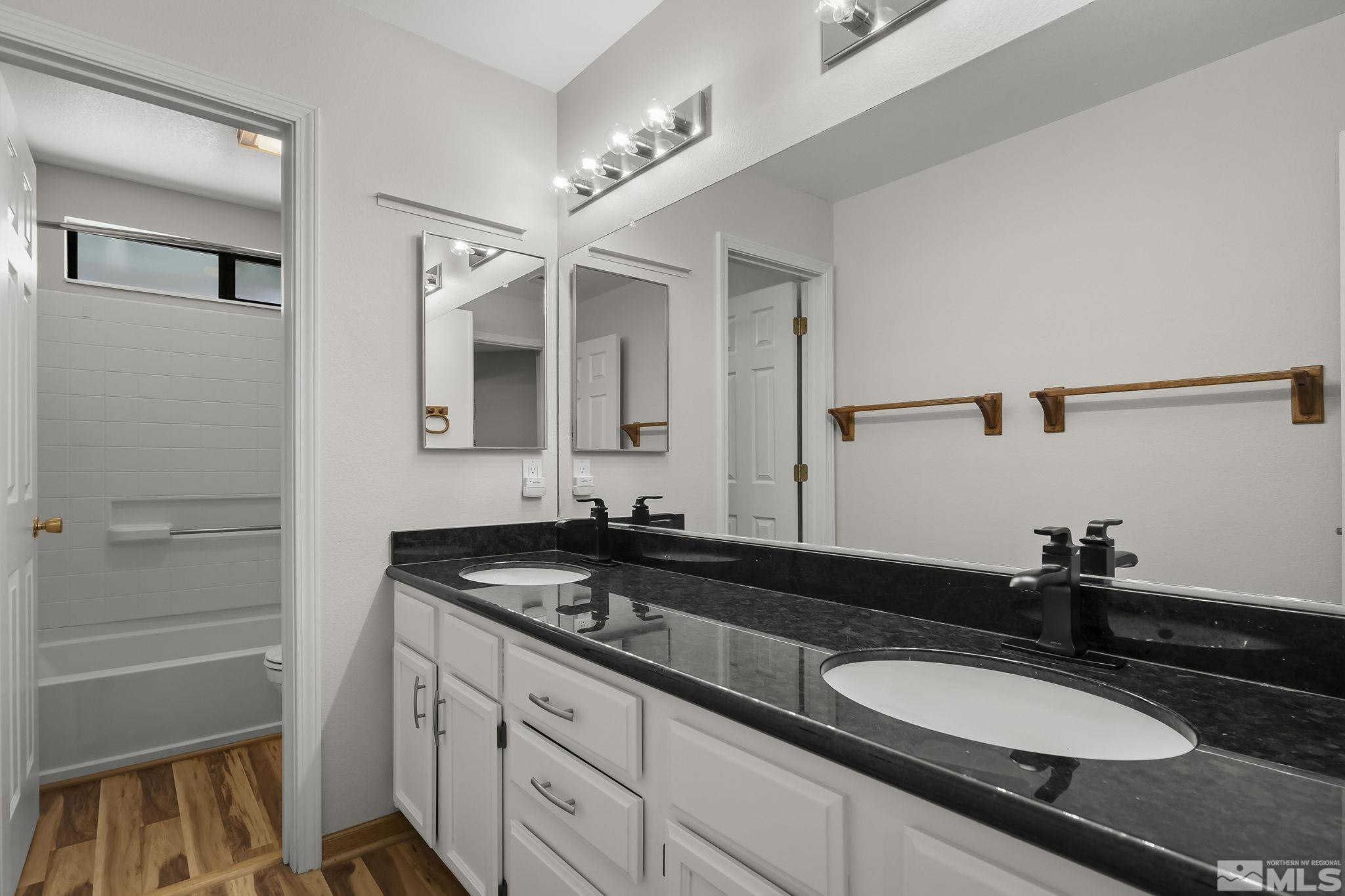 5380 Simons Drive Reno, NV 89523 - Photo 29 of 39 a bathroom with a sink and a mirror