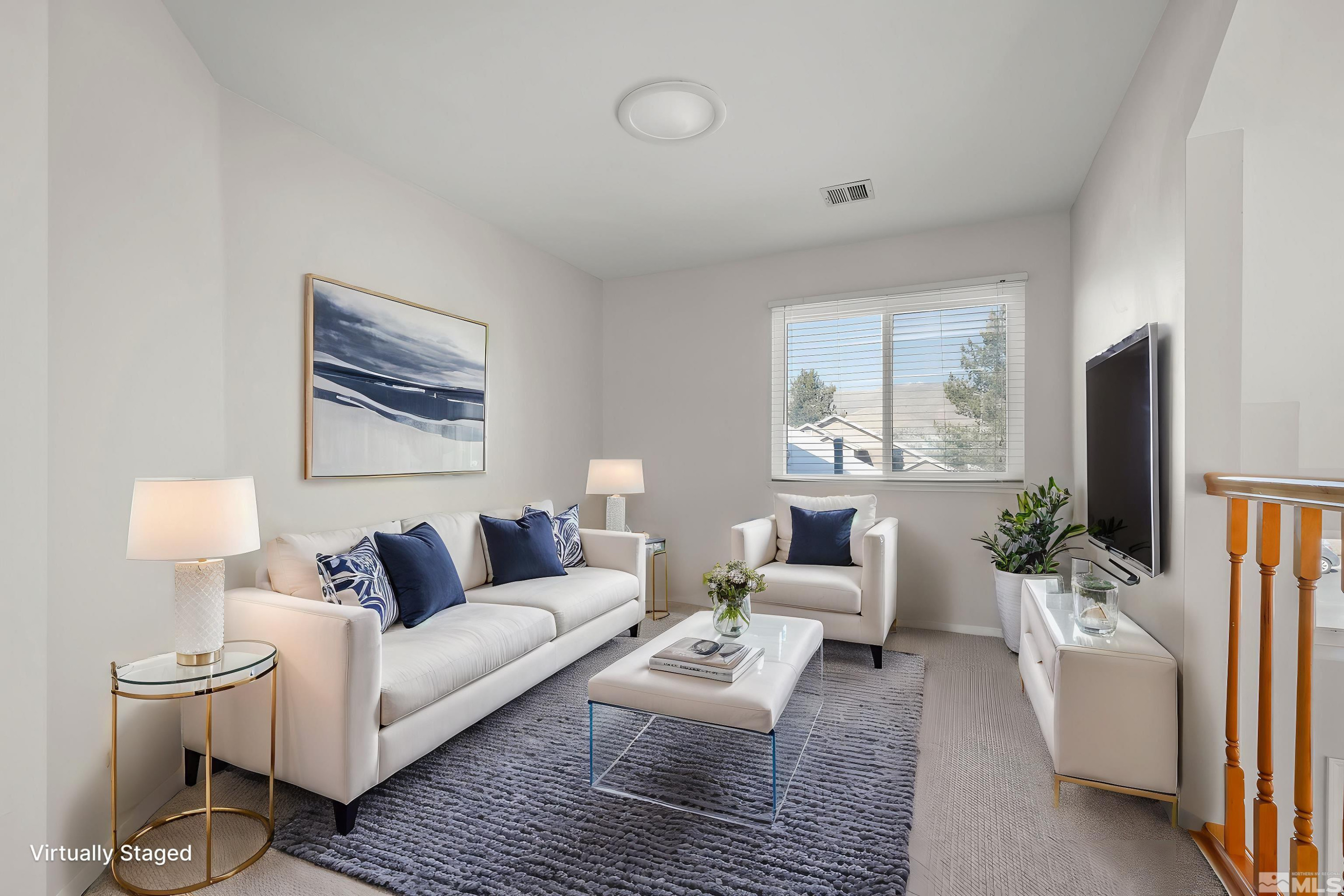 5380 Simons Drive Reno, NV 89523 - Photo 30 of 39 a living room with furniture a large window and a flat screen tv