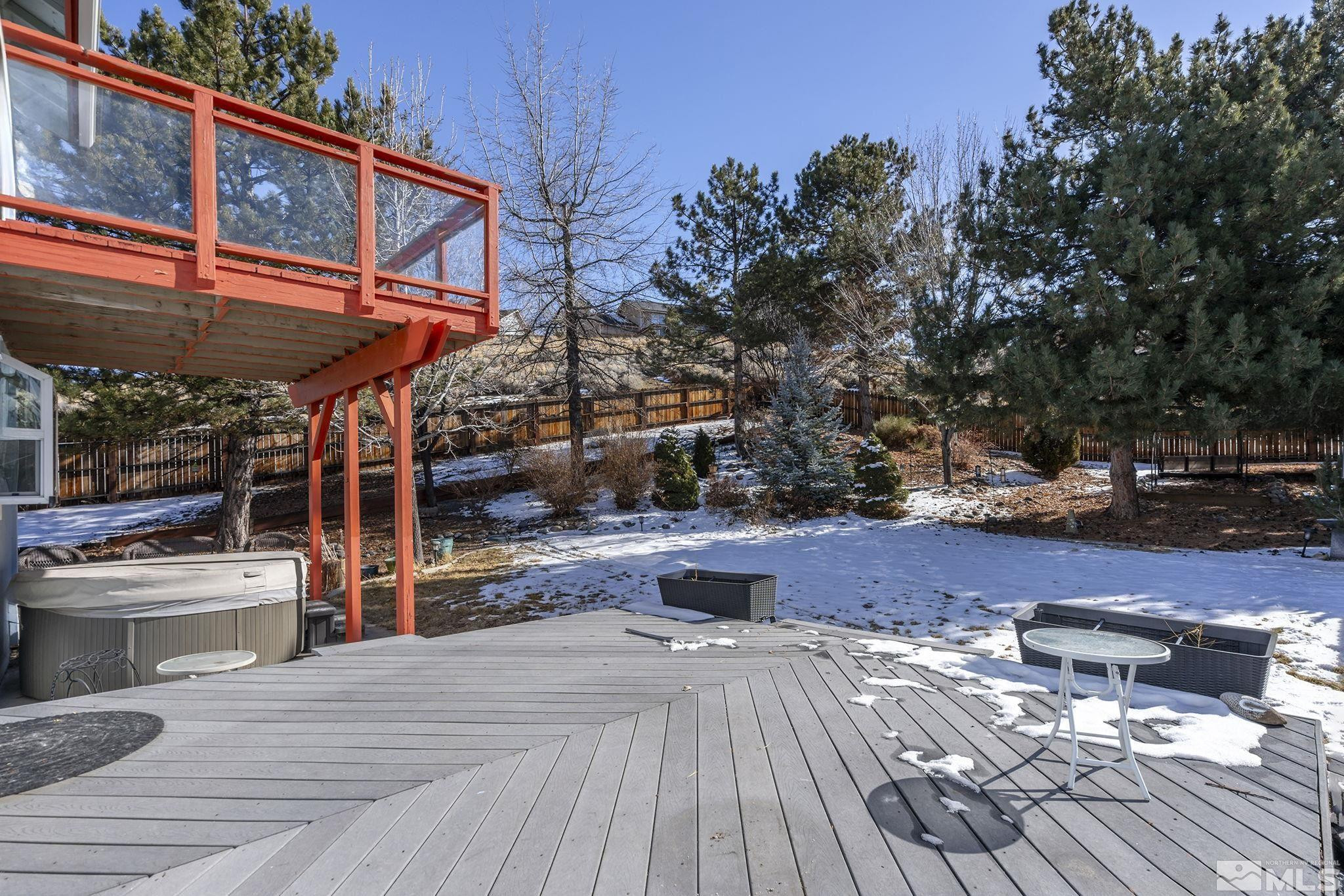 5380 Simons Drive Reno, NV 89523 - Photo 36 of 39 a view of a patio with table and chairs with wooden floor and fence