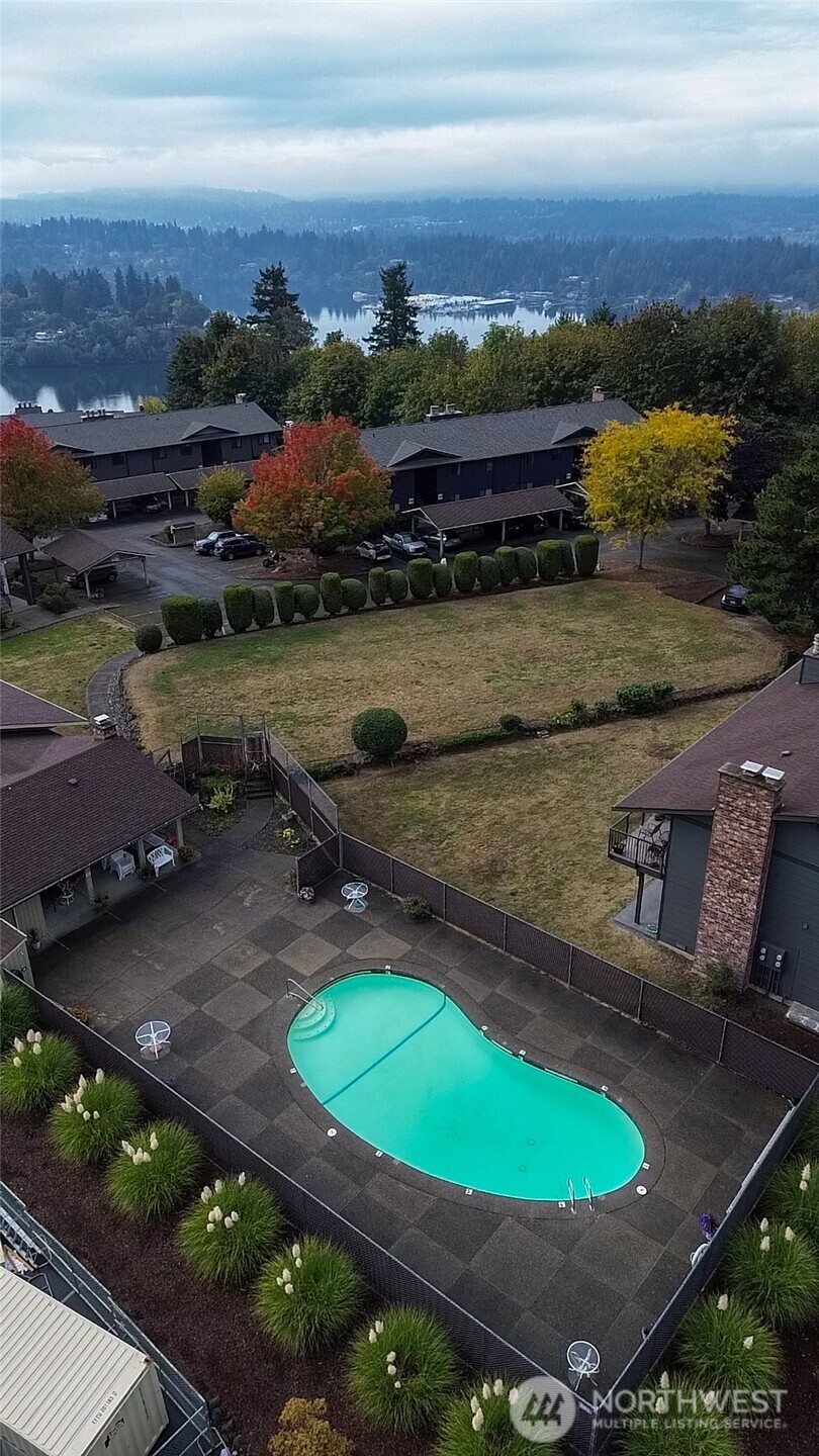 3560 Narrows View Lane Northeast, Unit 5201 Bremerton, WA 98310 - Photo 24 of 28 an aerial view of a house with a garden and lake view