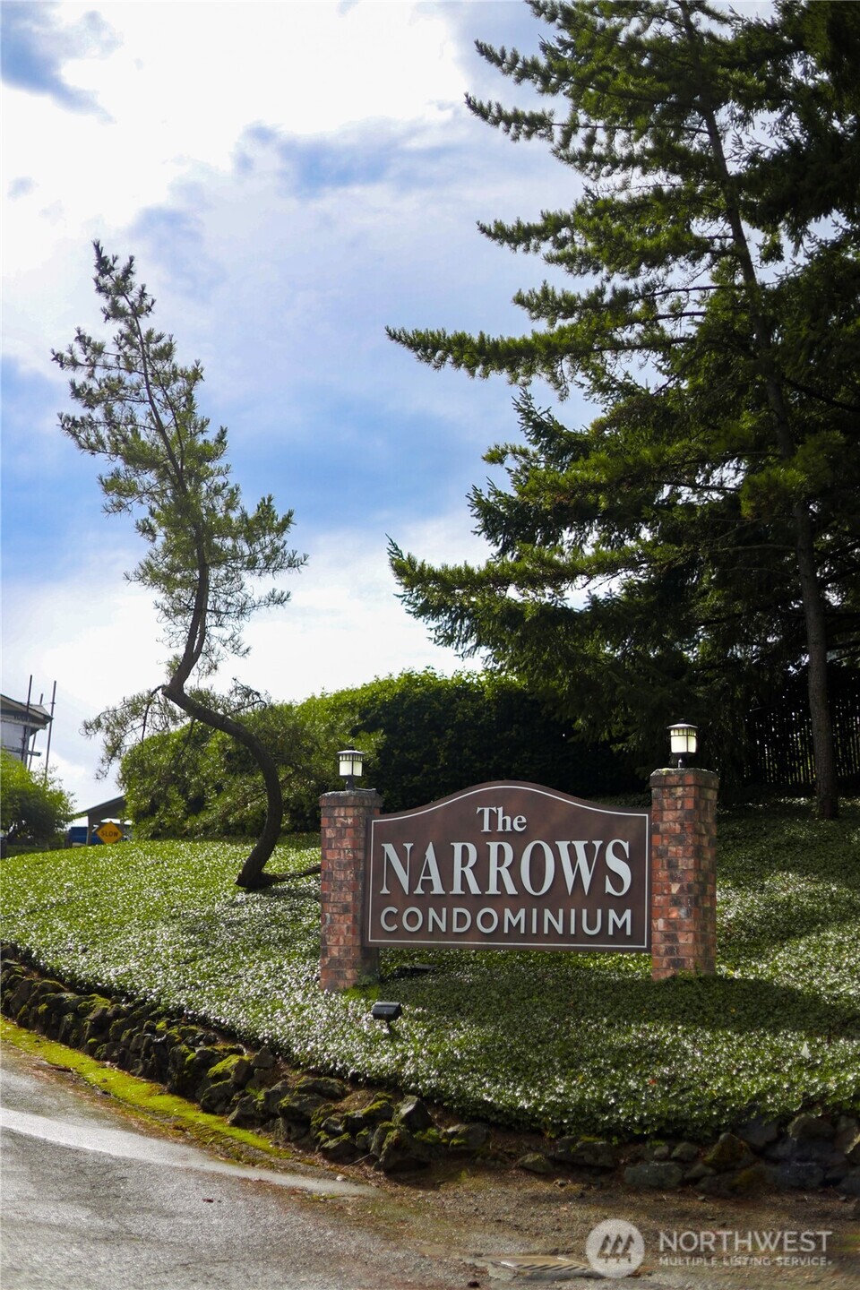 3560 Narrows View Lane Northeast, Unit 5201 Bremerton, WA 98310 - Photo 28 of 28 a view of a street sign under a large tree