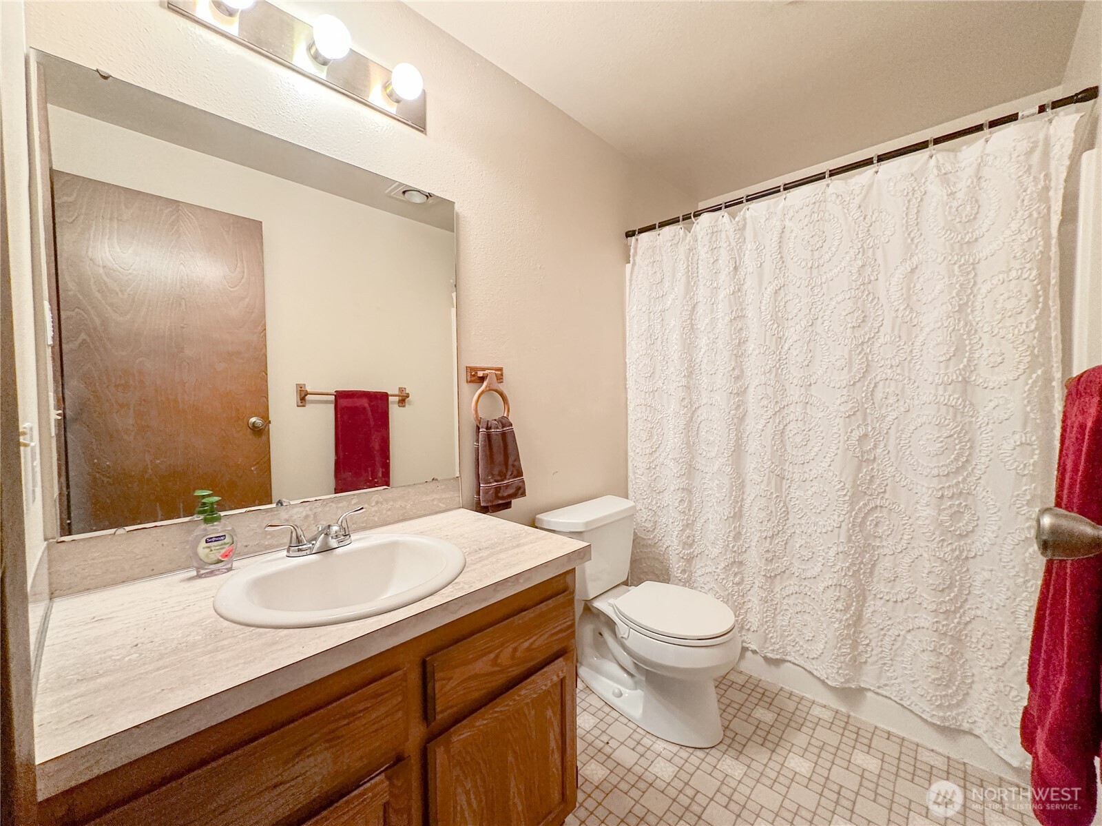 3560 Narrows View Lane Northeast, Unit 5201 Bremerton, WA 98310 - Photo 7 of 28 a bathroom with a sink toilet and shower
