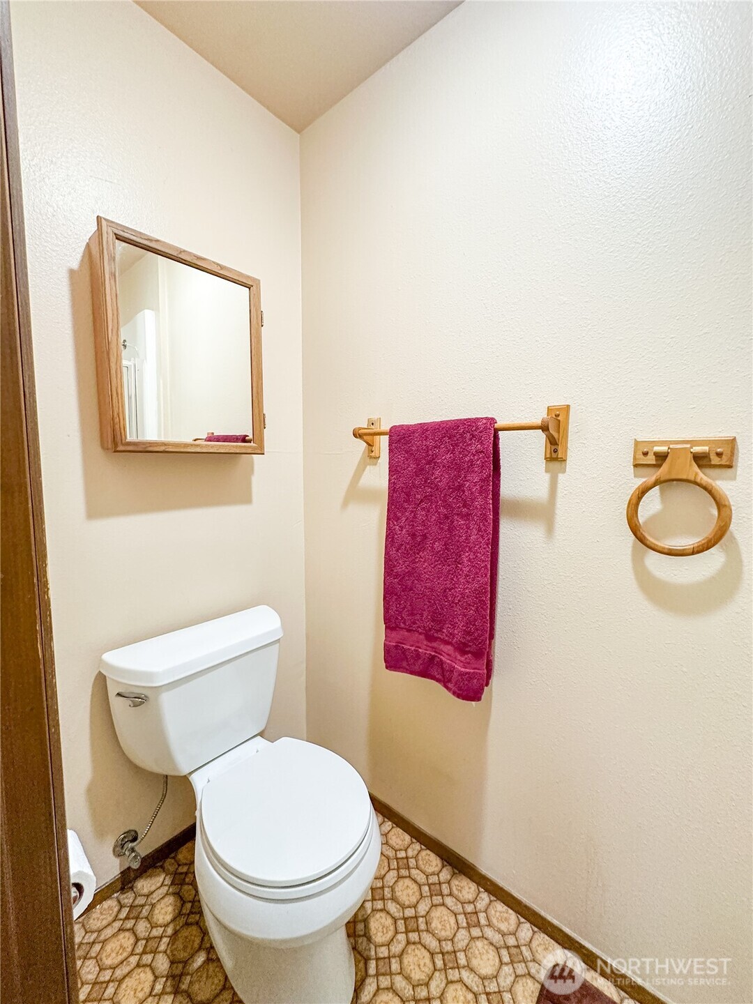 3560 Narrows View Lane Northeast, Unit 5201 Bremerton, WA 98310 - Photo 9 of 28 a white toilet sitting next to a bathroom sink