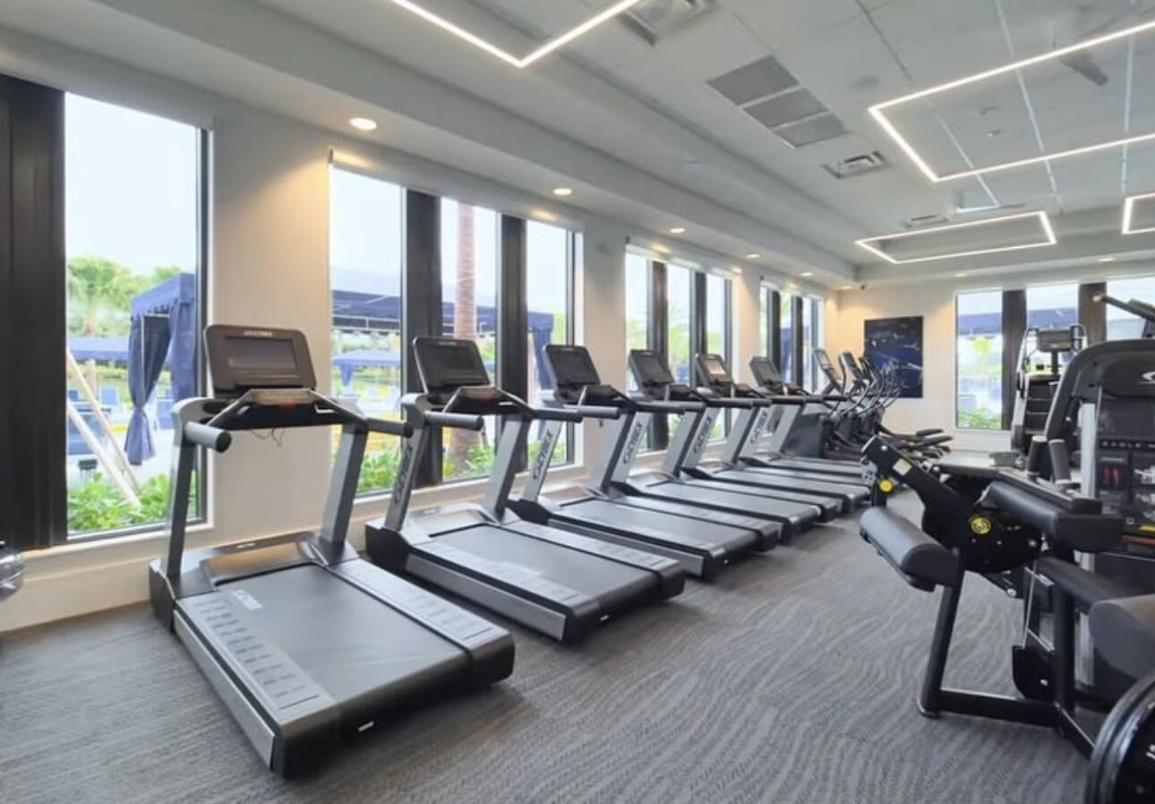 17496 Sparkling River Road Boca Raton, FL 33496 - Photo 32 of 36 a living room with hard wood floor and a table
