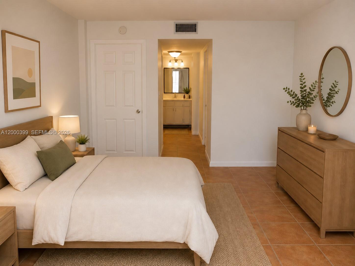8050 West McNab Road, Unit 206 Tamarac, FL 33321 - Photo 16 of 37 a bedroom with a bed and a dresser