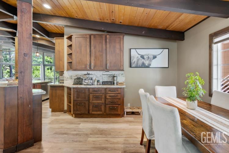 Undisclosed Address Wofford Heights, CA 93285 - Photo 11 of 35 a view of cabinets with wooden floor and furniture
