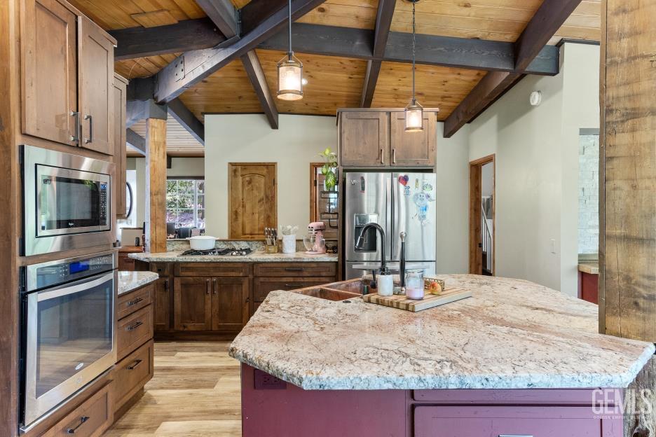 Undisclosed Address Wofford Heights, CA 93285 - Photo 20 of 35 a kitchen with kitchen island granite countertop a sink and counter space