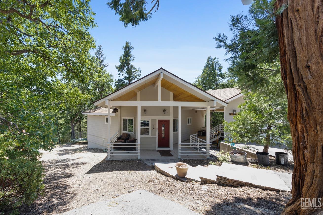 Undisclosed Address Wofford Heights, CA 93285 - Photo 2 of 35 a view of a house with backyard and sitting area