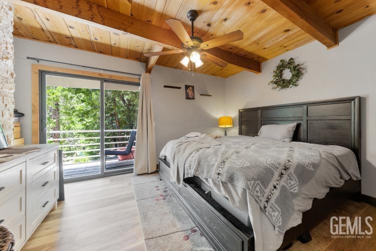 Undisclosed Address Wofford Heights, CA 93285 - Photo 24 of 35 a bed sitting in a bedroom next to a window