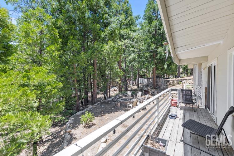 Undisclosed Address Wofford Heights, CA 93285 - Photo 31 of 35 a view of a balcony with wooden floor and bench