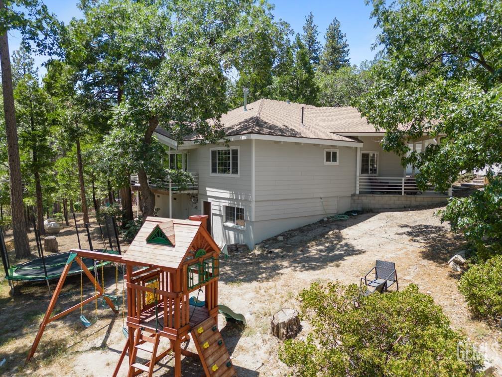 Undisclosed Address Wofford Heights, CA 93285 - Photo 5 of 35 a view of a patio with table and chairs with wooden fence and plants