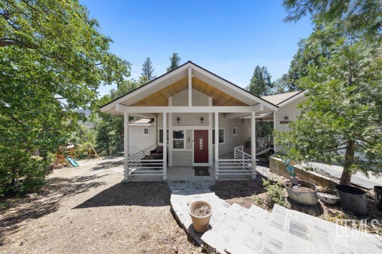 Undisclosed Address Wofford Heights, CA 93285 - Photo 6 of 35 a front view of a house with garden