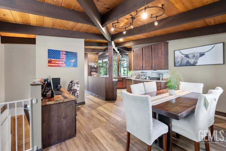 Undisclosed Address Wofford Heights, CA 93285 - Photo 8 of 35 a view of a dining room with furniture a chandelier and wooden floor
