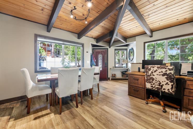 Undisclosed Address Wofford Heights, CA 93285 - Photo 9 of 35 a dining room with furniture a rug and a large window