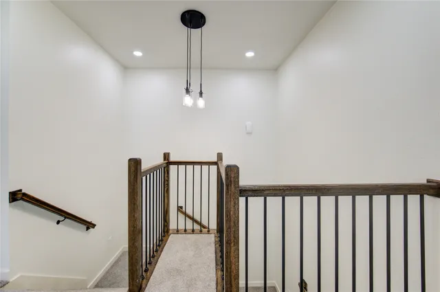 a view of a hallway with a chandelier
