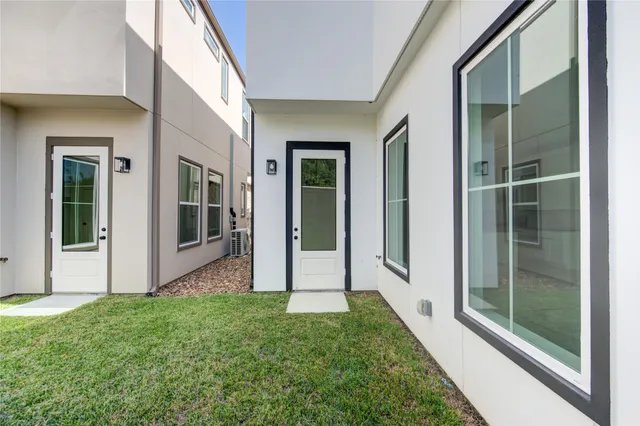 a view of front door and yard