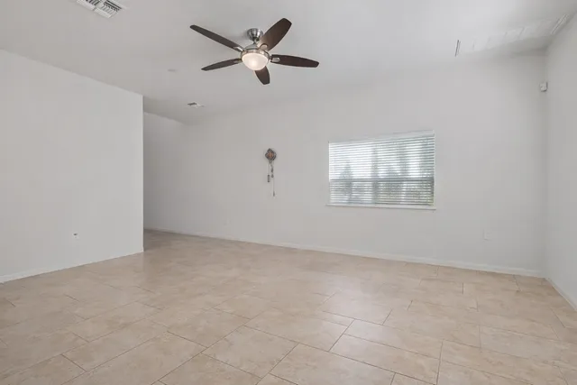 a view of a swimming pool with sitting area
