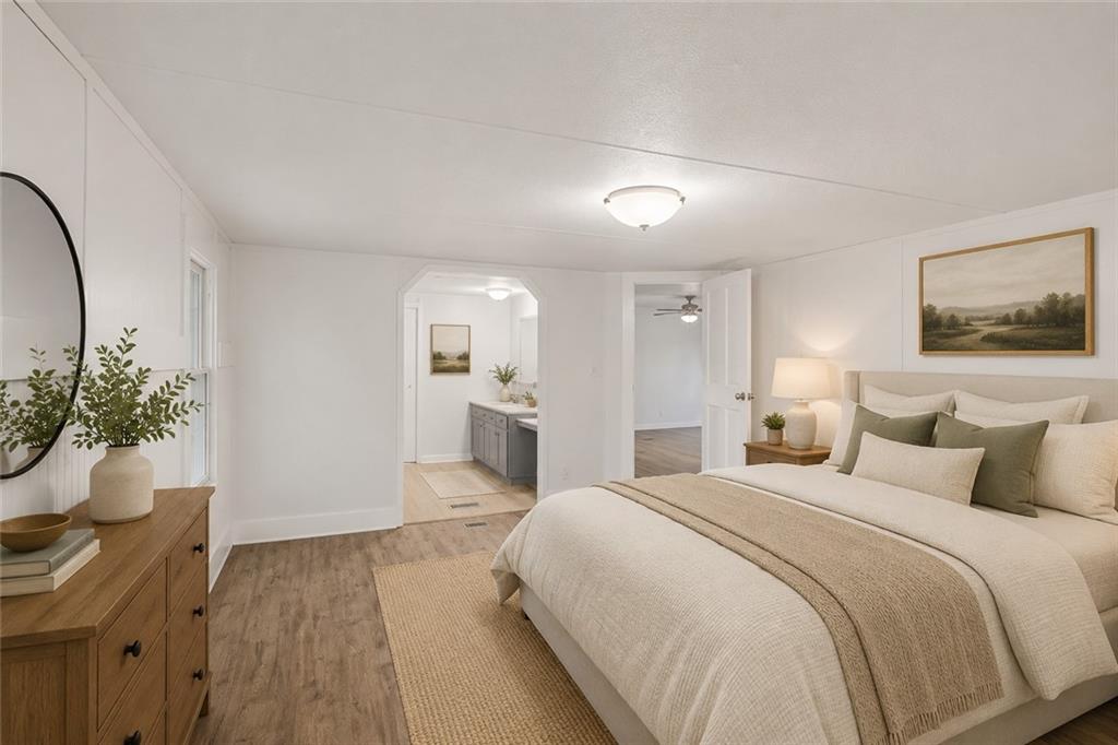 360 Black Knob Church Road Ranger, GA 30734 - Photo 12 of 20 a spacious bedroom with a bed and a potted plant