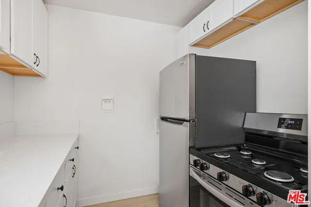 a kitchen with a stove and a microwave