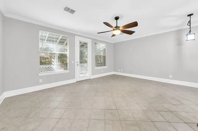 a view of a livingroom with furniture and a ceiling fan