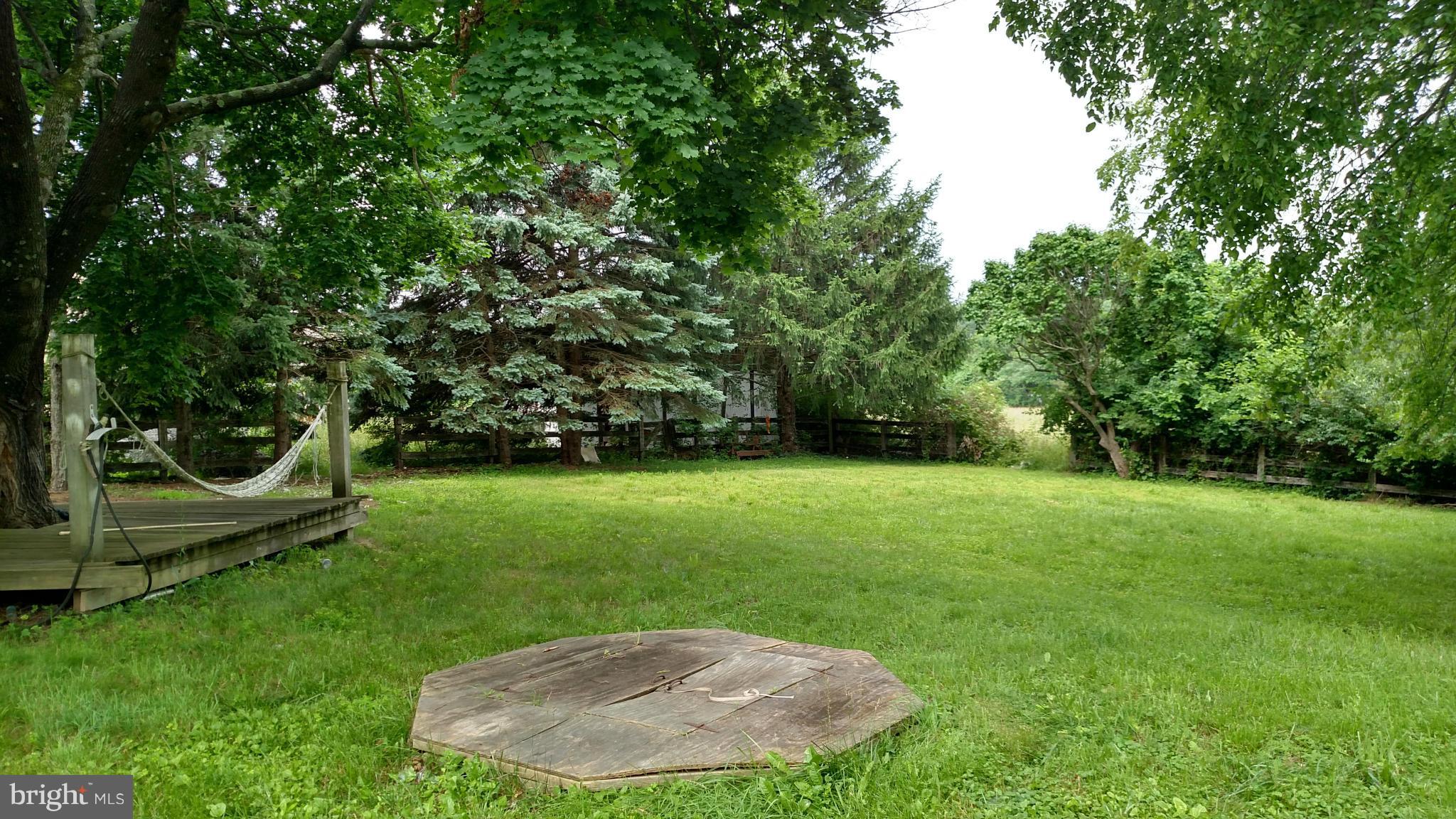 23820 Frederick Road Clarksburg, MD 20871 - Photo 3 of 7 a view of a backyard with a trampoline