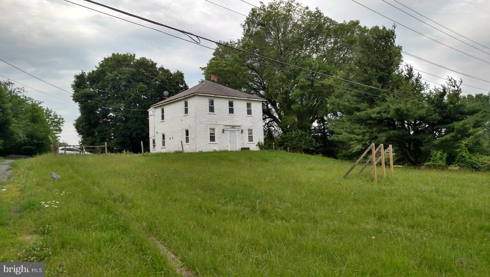 23820 Frederick Road Clarksburg, MD 20871 - Photo 7 of 7 a house with green field in front of it