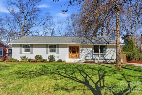 a front view of house with yard having outdoor seating