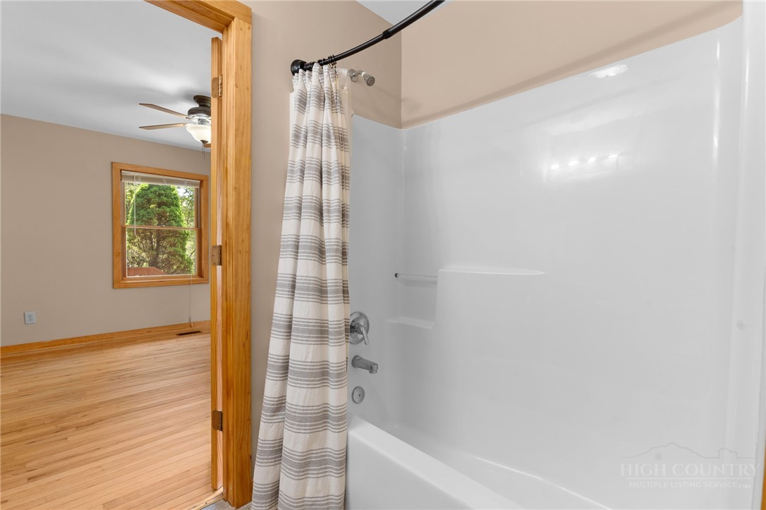 148 Woodby Ridge Road Vilas, NC 28692 - Photo 25 of 33 a bathroom with a shower and a tub
