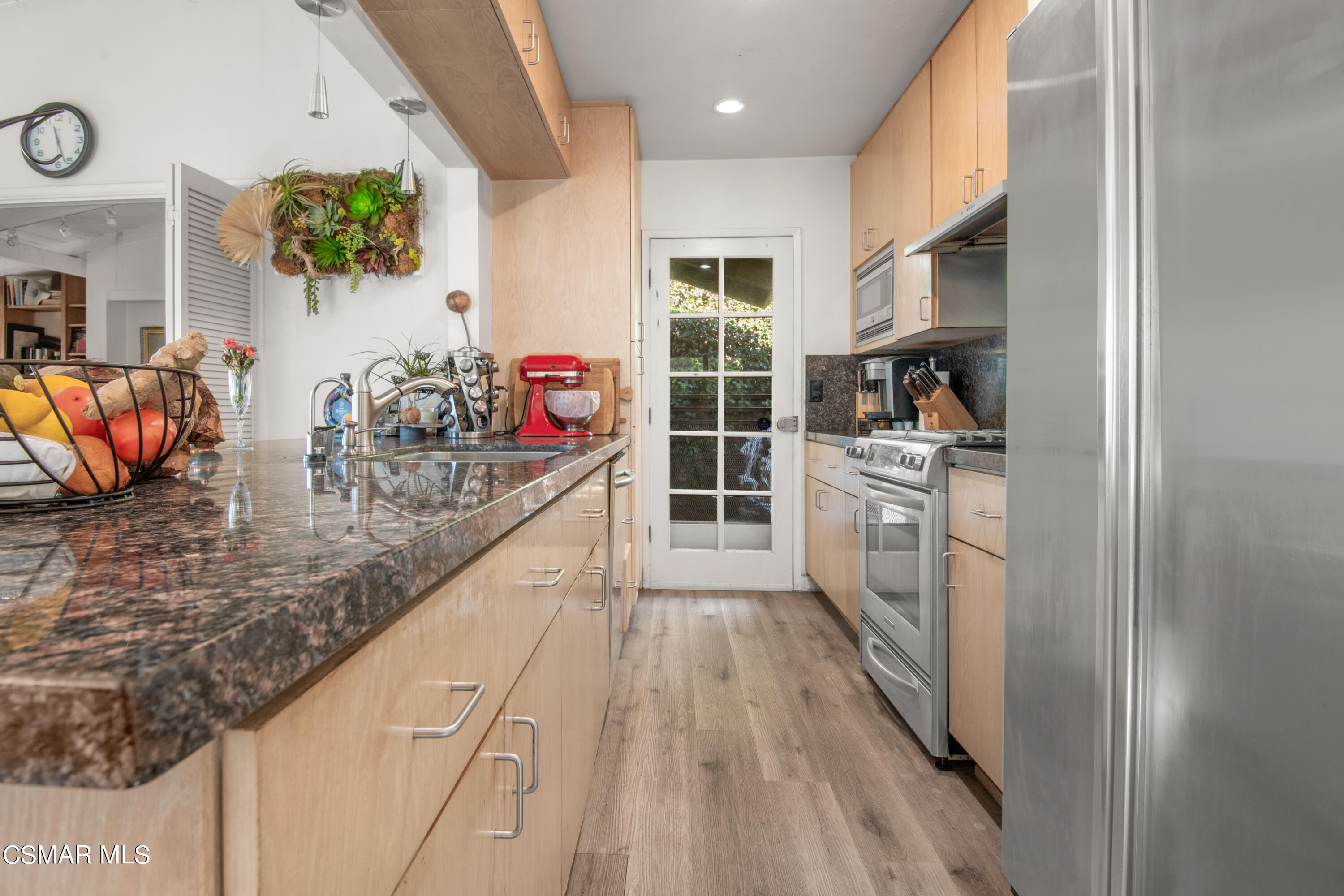 2420 Frey Avenue Venice, CA 90291 - Photo 9 of 24 a kitchen with stainless steel appliances granite countertop a lot of counter top space