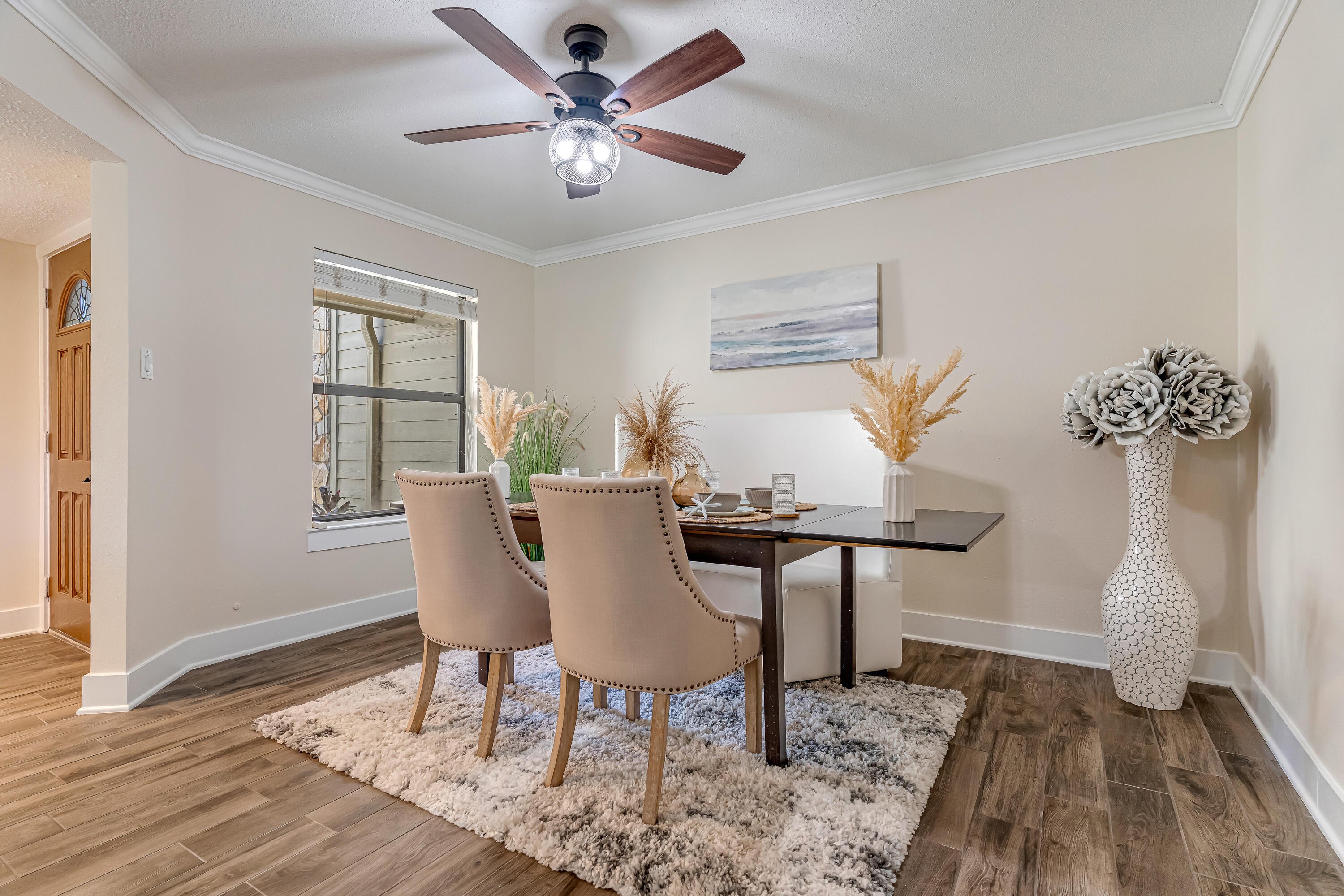 274 Kidd Street Fort Walton Beach, FL 32548 - Photo 10 of 74 a view of a dining room with furniture window and wooden floor