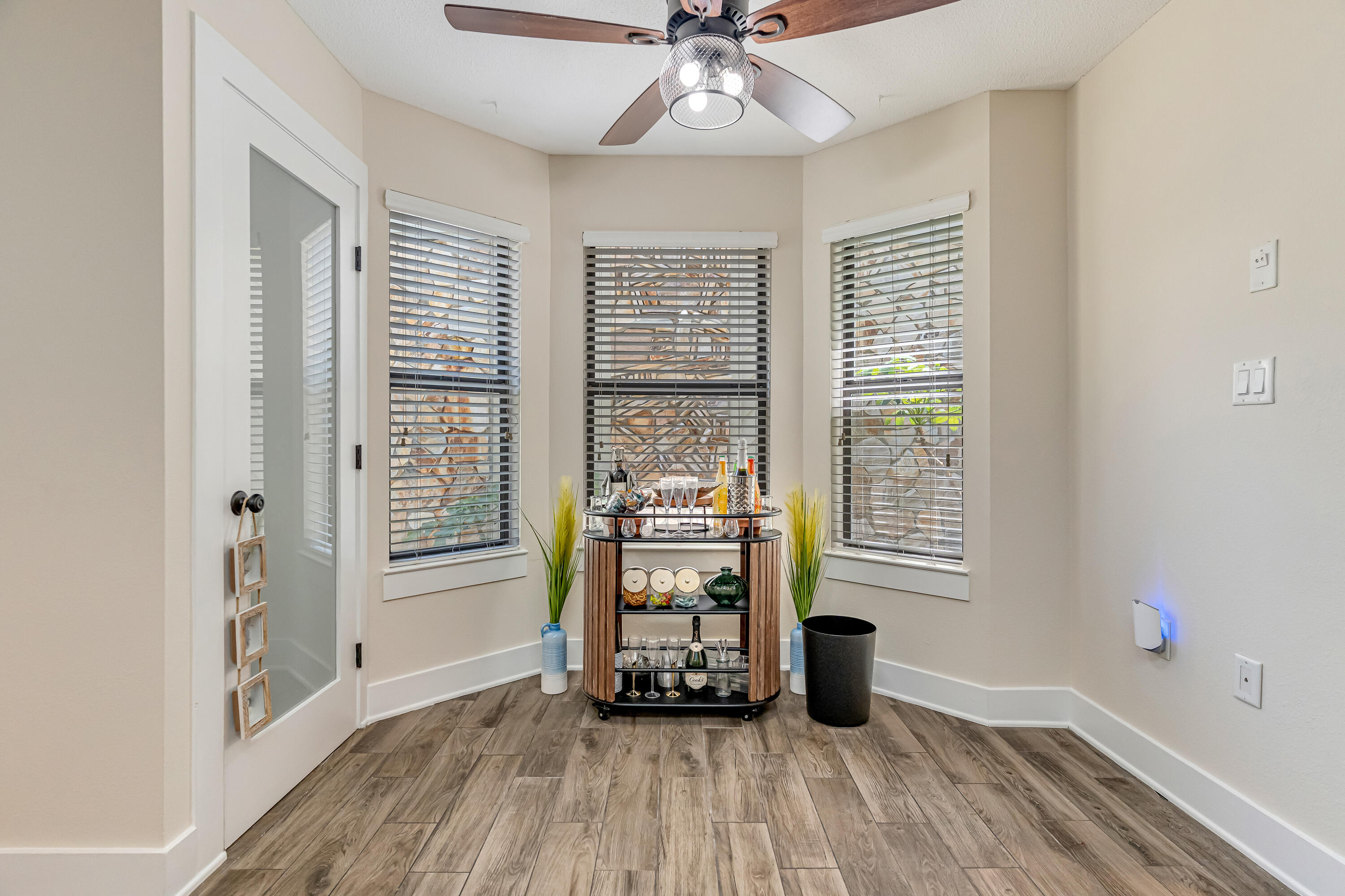 274 Kidd Street Fort Walton Beach, FL 32548 - Photo 19 of 74 a view of an empty room with a window and wooden floor