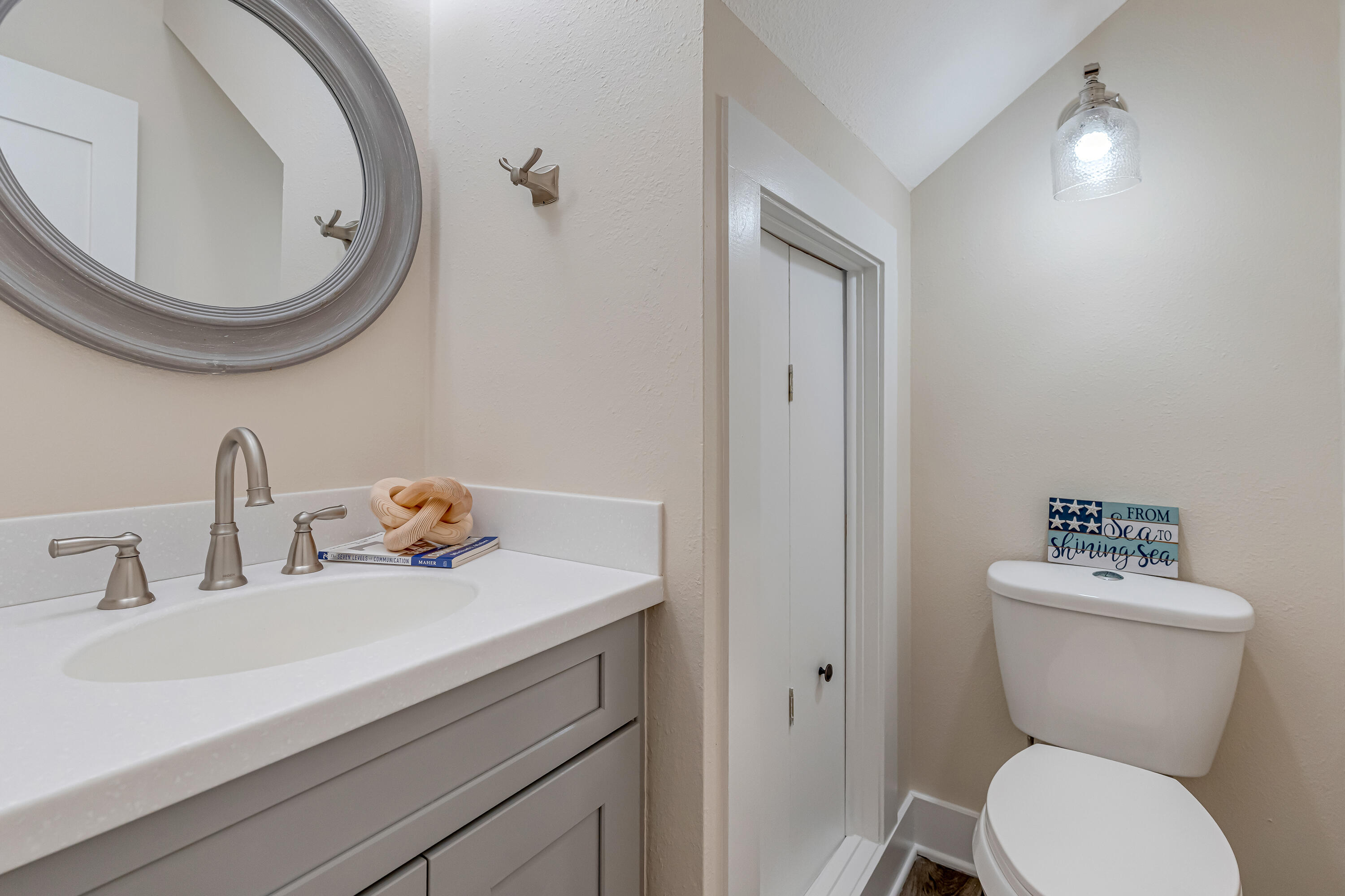 274 Kidd Street Fort Walton Beach, FL 32548 - Photo 20 of 74 a bathroom with a toilet sink and mirror