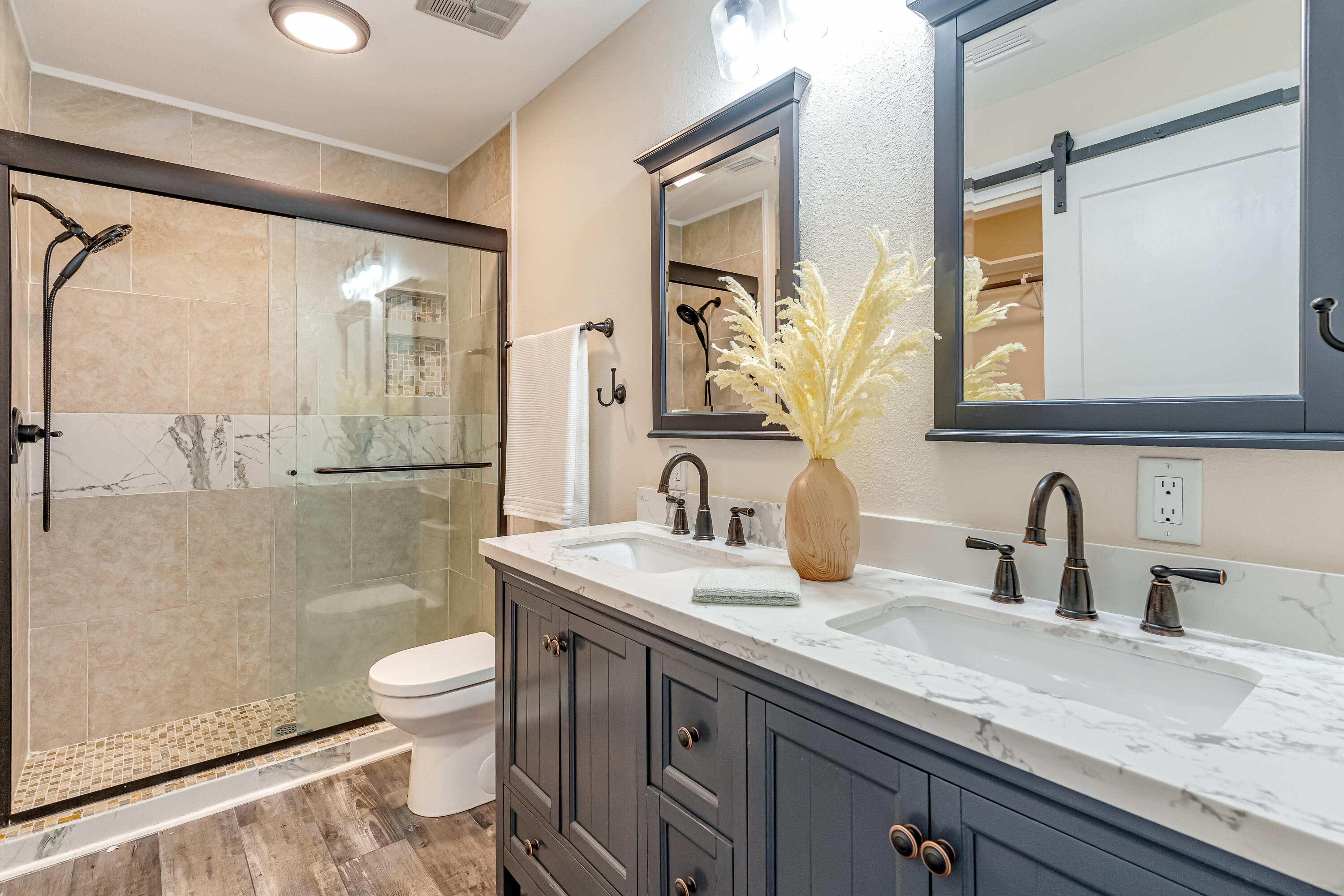 274 Kidd Street Fort Walton Beach, FL 32548 - Photo 34 of 74 a bathroom with a granite countertop sink a toilet a mirror and shower